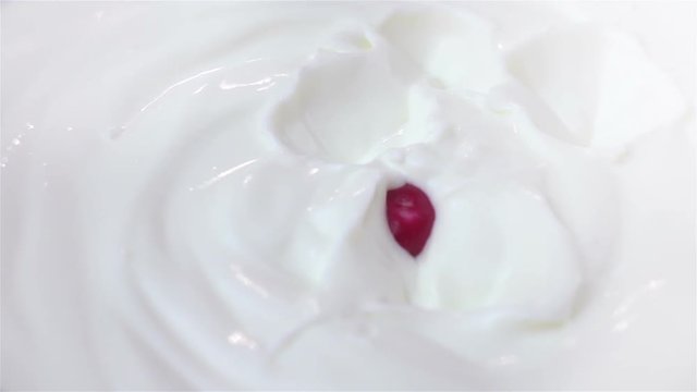 High quality video of radish falling into yogurt in real 1080p slow motion 250fps