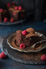 raspberry brownies served  with fresh berries