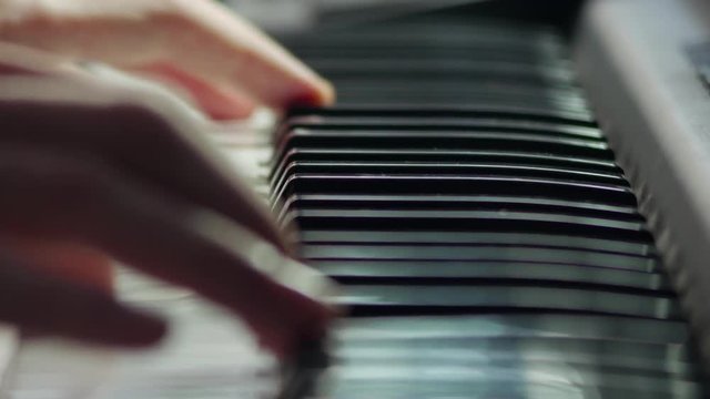 Pianist playing close up 4K UHD 2160p stock video shallow depth of field