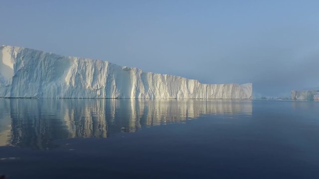  Arctic Icebergs Greenland in the arctic sea. You can easily see that iceberg is over the water surface, and below the water surface. 