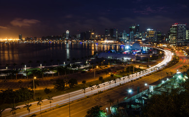 Fototapeta na wymiar Skyline of capital city Luanda and its seaside during the night, Angola, Africa