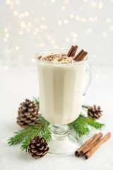 Christmas drink eggnog with whipped cream and cinnamon