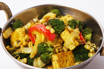 Vegan and vegetarian indian restaurant dish, tofu stir fry isolated