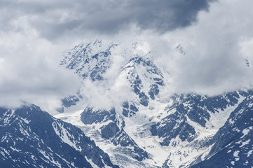 Obraz premium Snow top/Snowy peak in the clouds, Altai Mountains, Siberia, Russia