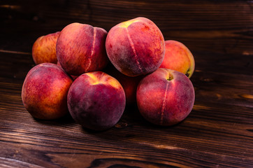 Fresh ripe peaches on wooden table