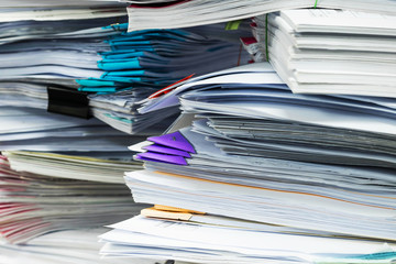 Paper documents stacked in archive