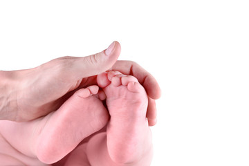 Baby's feet in mother's hands