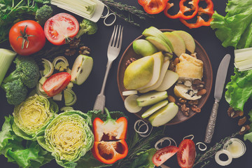 Eating healthy food on black background