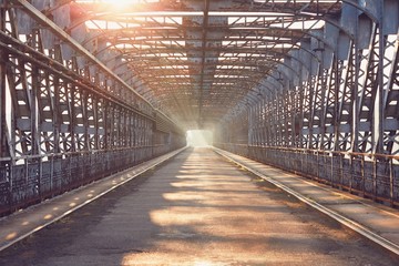 Long iron bridge at sunrise