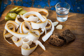 fresh sliced ​​bacon on 
board with alcohol