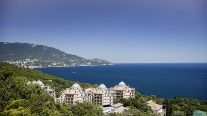 Fototapeta na wymiar view from the height of the resort town of Yalta and the Black Sea from the mountains of Ai-Petri