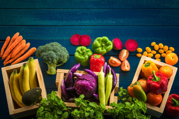 Top view of fresh vegetables on table, Fresh vegetables in wooden container with copy space