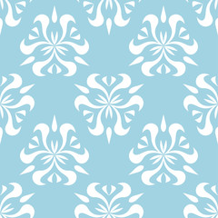 Fototapeta na wymiar White floral ornament on blue background. Seamless pattern for textile and wallpapers