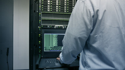 Close up part of administrator working in data center