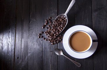 Coffee beans and sweet coffee in white coffee cup