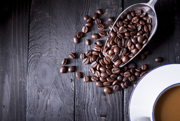 Coffee beans on black wood table