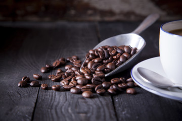 Coffee beans on black wood table with beautiful studio light