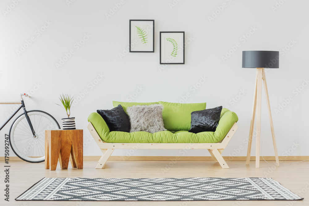 Wall mural Green sofa and black accent