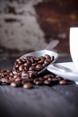 Coffee beans in iron scoop
