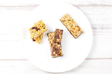 Chocolate, fruits and berries granola bars closeup