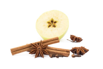 apple, star anise, cloves and cinnamon isolated on white background
