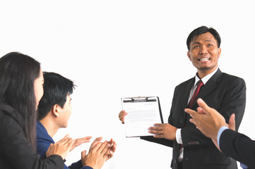 Asian businessman in suit present contract detail and achievement to team