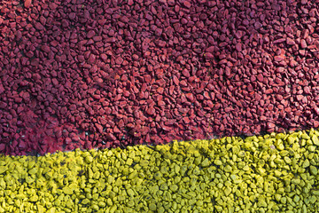 Background of colored small pebbles. The background is divided into two halves. Texture of two parts.