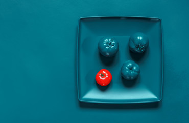 Painted Turquoise plate, cutlery and tomatoes
