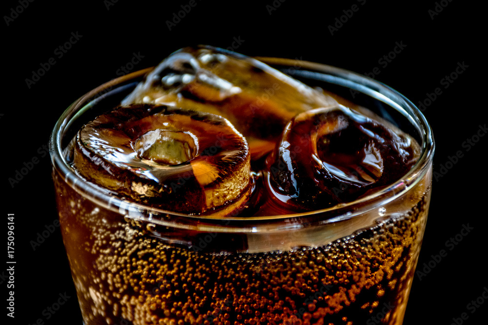 Sticker cola with ice,food background.glass of cola with ice cubes on black background.glasses of sweet carb