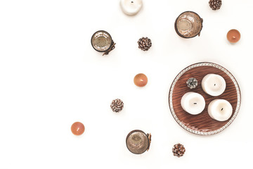 Christmas candle, candlestick, pine cone, christmas decoration on white background. Top view, flat lay