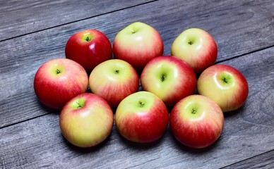 Ripe apples on a wooden table.Ripe apples on a wooden background.