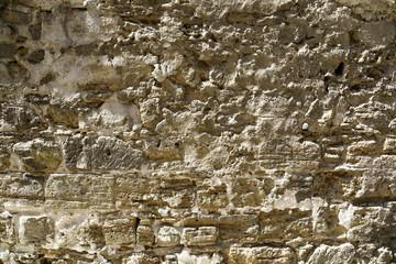 old stone wall of an ancient building