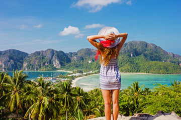 Girl at the resort in a dress on the background of the bays of the island of Phi Phi Don