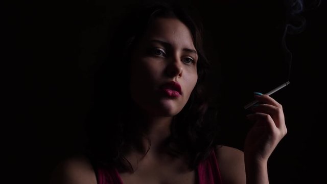 An angry sad teen girl with a cigarette