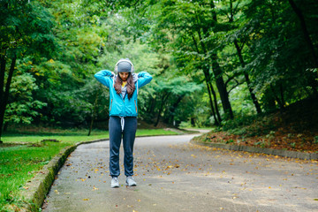 young pretty woman was interrupted video call while run in the park