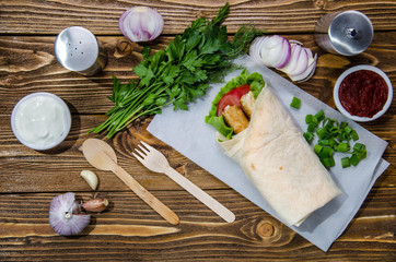 pita with vegetables on a wooden table