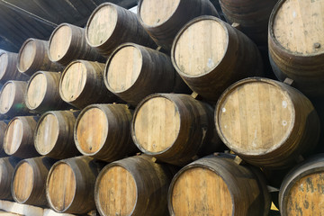 background of traditional aged wooden wine barrels