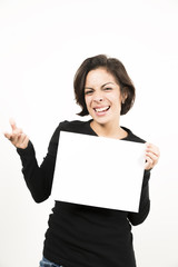 Naklejka premium Beautiful young woman holding a blank sheet of paper
