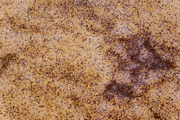 A background of an orange and black tile