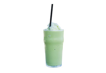green tea frappe ice shake in glass with brown drinking straw isolated on white background.