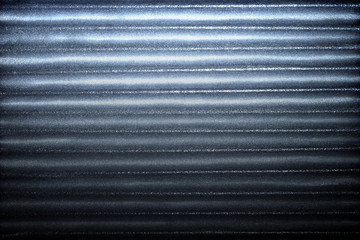 Cold blue corrugated metallic texture industrial abstract pattern background with ridges gradation