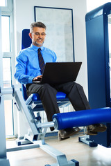 Sporty businessman,training in gym