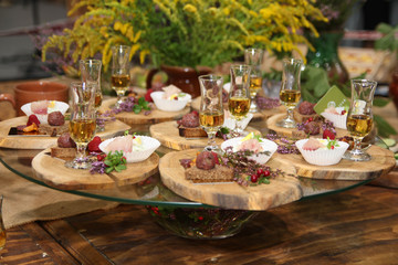 Canape with meet on the wooden board 