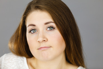 Attractive young woman being confused