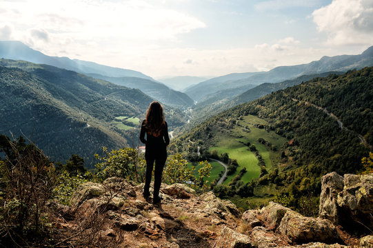 Woman on the top of a mountain