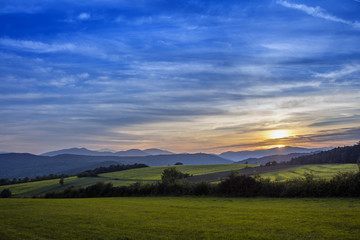 beautiful sunset over the green valley 