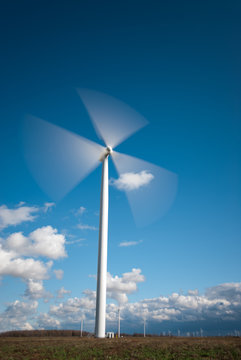 Industrial Wind Turbine Green Energy Generation on Wind Farm With Clear Blue Sky Ontario Canada