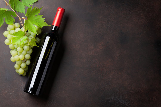Wine bottle and grapes