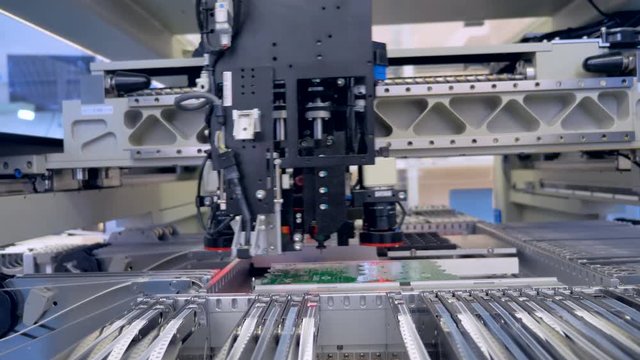 Automated Circut Board machine Produces Printed digital electronic board. 4K.