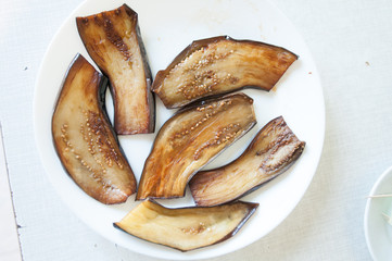 Sliced eggplant on white plate
